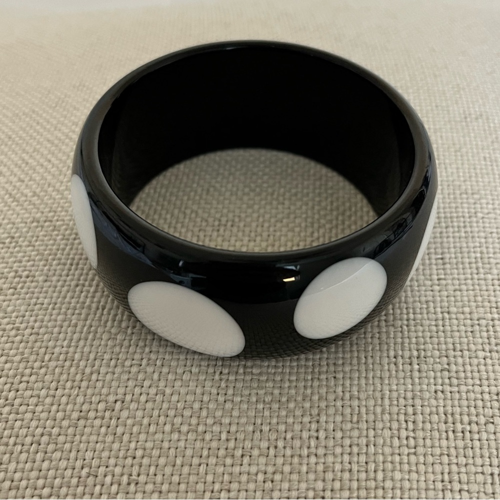 Vintage plastic bangle bracelet with polka dots, looks new